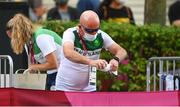 6 August 2021; Ray Flynn prepares a towel for Brendan Boyce of Ireland during the men's 50 kilometre walk final at Sapporo Odori Park on day 14 during the 2020 Tokyo Summer Olympic Games in Sapporo, Japan. Photo by Ramsey Cardy/Sportsfile