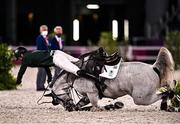 6 August 2021; Shane Sweetnam of Ireland falls from Alejandro at the 9th fence during the jumping team qualifier at the Equestrian Park during the 2020 Tokyo Summer Olympic Games in Tokyo, Japan. Photo by Brendan Moran/Sportsfile