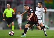 3 August 2021; Liam Burt of Bohemians and Rodrigo Soares of PAOK during the UEFA Europa Conference League third qualifying round first leg match between Bohemians and PAOK at Aviva Stadium in Dublin. Photo by Ben McShane/Sportsfile