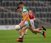 31 July 2021; Cathal Donoghue of Offaly in action against Darragh Holland of Cork during the 2021 EirGrid GAA All-Ireland Football U20 Championship Semi-Final match between Cork and Offaly at MW Hire O'Moore Park in Portlaoise, Laois. Photo by Matt Browne/Sportsfile