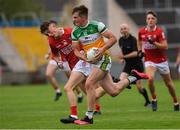 31 July 2021; Cathal Donoghue of Offaly in action against Darragh Holland of Cork during the 2021 EirGrid GAA All-Ireland Football U20 Championship Semi-Final match between Cork and Offaly at MW Hire O'Moore Park in Portlaoise, Laois. Photo by Matt Browne/Sportsfile