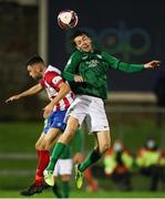 6 August 2021; Alex Aspil of Cabinteely in action against Edmond O'Dwyer of Treaty United during the SSE Airtricity League First Division match between Treaty United and Cabinteely at Markets Field in Limerick. Photo by Michael P Ryan/Sportsfile