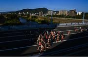 7 August 2021; Runners cross Horohira Bridge during the women's marathon on day 15 during the 2020 Tokyo Summer Olympic Games in Sapporo, Japan. Photo by Ramsey Cardy/Sportsfile