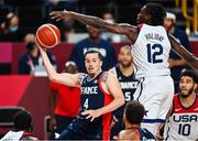 7 August 2021; Thomas Heurtel of France in action against Jrue Holiday of USA during the men's gold medal match between the USA and France at the Saitama Super Arena during the 2020 Tokyo Summer Olympic Games in Tokyo, Japan. Photo by Brendan Moran/Sportsfile