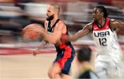 7 August 2021; Evan Fournier of France in action against Jrue Holiday of USA during the men's gold medal match between the USA and France at the Saitama Super Arena during the 2020 Tokyo Summer Olympic Games in Tokyo, Japan. Photo by Brendan Moran/Sportsfile
