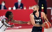 7 August 2021; Evan Fournier of France in action against Jrue Holiday of USA during the men's gold medal match between the USA and France at the Saitama Super Arena during the 2020 Tokyo Summer Olympic Games in Tokyo, Japan. Photo by Brendan Moran/Sportsfile