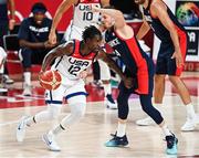 7 August 2021; Jrue Holiday of USA in action against Thomas Heurtel of France during the men's gold medal match between the USA and France at the Saitama Super Arena during the 2020 Tokyo Summer Olympic Games in Tokyo, Japan. Photo by Brendan Moran/Sportsfile