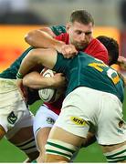 7 August 2021; Finn Russell of British and Irish Lions is tackled by Kwagga Smith, right, and Eben Etzebeth of South Africa during the third test of the British and Irish Lions tour match between South Africa and British and Irish Lions at Cape Town Stadium in Cape Town, South Africa. Photo by Ashley Vlotman/Sportsfile
