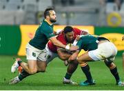 7 August 2021; Bundee Aki of the British & Irish Lions is tackled by Cobus Reinach, left, and Handré Pollard of South Africa during the third test of the British and Irish Lions tour match between South Africa and British and Irish Lions at Cape Town Stadium in Cape Town, South Africa. Photo by Ashley Vlotman/Sportsfile