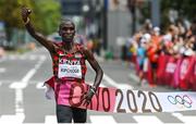 8 August 2021; Eliud Kipchoge of Kenya celebrates as he crosses the finish line to win the men's marathon at Sapporo Odori Park on day 16 during the 2020 Tokyo Summer Olympic Games in Sapporo, Japan. Photo by Ramsey Cardy/Sportsfile