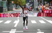 8 August 2021; Eliud Kipchoge of Kenya celebrates as he crosses the finish line to win the men's marathon at Sapporo Odori Park on day 16 during the 2020 Tokyo Summer Olympic Games in Sapporo, Japan. Photo by Ramsey Cardy/Sportsfile