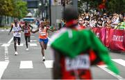 8 August 2021; Abdi Nageeye of Netherlands approaches the finish line in second place as Eliud Kipchoge of Kenya waits to greet him during the men's marathon at Sapporo Odori Park on day 16 during the 2020 Tokyo Summer Olympic Games in Sapporo, Japan. Photo by Ramsey Cardy/Sportsfile