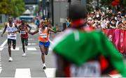 8 August 2021; Abdi Nageeye of Netherlands approaches the finish line in second place as Eliud Kipchoge of Kenya waits to greet him during the men's marathon at Sapporo Odori Park on day 16 during the 2020 Tokyo Summer Olympic Games in Sapporo, Japan. Photo by Ramsey Cardy/Sportsfile