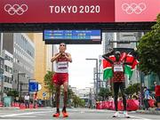 8 August 2021; Ayad Lamdassem of Spain, left, and Eliud Kipchoge of Kenya following the men's marathon at Sapporo Odori Park on day 16 during the 2020 Tokyo Summer Olympic Games in Sapporo, Japan. Photo by Ramsey Cardy/Sportsfile