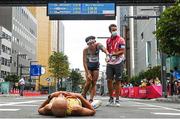 8 August 2021; Jungsub Shim of Republic of Korea receives medical attention after the men's marathon at Sapporo Odori Park on day 16 during the 2020 Tokyo Summer Olympic Games in Sapporo, Japan. Photo by Ramsey Cardy/Sportsfile