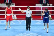 8 August 2021; Kellie Harrington of Ireland, left, reacts after being announced as the winner in her lightweight final bout with Beatriz Ferreira of Brazil at the Kokugikan Arena during the 2020 Tokyo Summer Olympic Games in Tokyo, Japan. Photo by Brendan Moran/Sportsfile