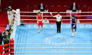 8 August 2021; Kellie Harrington of Ireland, left, reacts after being announced as the winner in her lightweight final bout with Beatriz Ferreira of Brazil at the Kokugikan Arena during the 2020 Tokyo Summer Olympic Games in Tokyo, Japan. Photo by Brendan Moran/Sportsfile