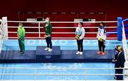 8 August 2021; Silver medalist Beatriz Ferreira of Brazil, left, gold medalist Kellie Harrington of Ireland, centre, and bronze medalists Mira Marjut Johanna Potkonen of Finland and Sudaporn Seesondee of Thailand stand for the playing of the Irish national anthem after the women's lightweight bouts at the Kokugikan Arena during the 2020 Tokyo Summer Olympic Games in Tokyo, Japan. Photo by Brendan Moran/Sportsfile