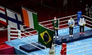 8 August 2021; Kellie Harrington of Ireland stands for the playing of the Irish national anthem after receiving her gold medal after defeating Beatriz Ferreira of Brazil in their women's lightweight final bout with at the Kokugikan Arena during the 2020 Tokyo Summer Olympic Games in Tokyo, Japan. Photo by Brendan Moran/Sportsfile