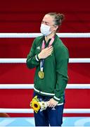 8 August 2021; Kellie Harrington of Ireland stands for the playing of the Irish national anthem after receiving her gold medal after defeating Beatriz Ferreira of Brazil in their women's lightweight final bout with at the Kokugikan Arena during the 2020 Tokyo Summer Olympic Games in Tokyo, Japan. Photo by Brendan Moran/Sportsfile