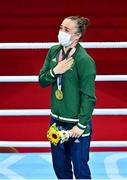 8 August 2021; Kellie Harrington of Ireland stands for the playing of the Irish national anthem after receiving her gold medal after defeating Beatriz Ferreira of Brazil in their women's lightweight final bout with at the Kokugikan Arena during the 2020 Tokyo Summer Olympic Games in Tokyo, Japan. Photo by Brendan Moran/Sportsfile