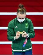 8 August 2021; Kellie Harrington of Ireland looks at her her gold medal during the medal ceremony after defeating Beatriz Ferreira of Brazil in their women's lightweight final bout with at the Kokugikan Arena during the 2020 Tokyo Summer Olympic Games in Tokyo, Japan. Photo by Brendan Moran/Sportsfile