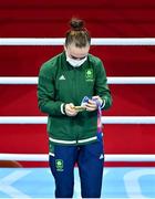 8 August 2021; Kellie Harrington of Ireland looks at her her gold medal during the medal ceremony after defeating Beatriz Ferreira of Brazil in their women's lightweight final bout with at the Kokugikan Arena during the 2020 Tokyo Summer Olympic Games in Tokyo, Japan. Photo by Brendan Moran/Sportsfile