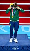 8 August 2021; Kellie Harrington of Ireland puts on her her gold medal during the medal ceremony after defeating Beatriz Ferreira of Brazil in their women's lightweight final bout with at the Kokugikan Arena during the 2020 Tokyo Summer Olympic Games in Tokyo, Japan. Photo by Brendan Moran/Sportsfile