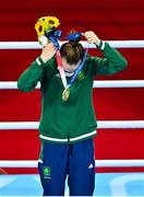 8 August 2021; Kellie Harrington of Ireland puts on her her gold medal during the medal ceremony after defeating Beatriz Ferreira of Brazil in their women's lightweight final bout with at the Kokugikan Arena during the 2020 Tokyo Summer Olympic Games in Tokyo, Japan. Photo by Brendan Moran/Sportsfile