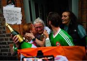 8 August 2021; Kellie Harrington's mother Yvonne and her brother Chirstopher and a neighbour celebrate outside their home at Portland Row in Dublin, after her Tokyo 2020 Olympics lightweight final bout against Beatriz Ferreira of Brazil.  Photo by Ray McManus/Sportsfile