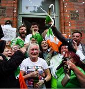 8 August 2021; Champagne flows as Kellie Harrington's mother Yvonne is congratulated outside her Portland Row home, after watching Kellie's Tokyo 2020 Olympics lightweight final bout against Beatriz Ferreira of Brazil. Photo by Ray McManus/Sportsfile