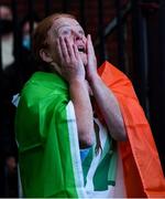 8 August 2021; A neighbour of Kellie Harrington's family, from Portland Row in Dublin, Aeo Gately watching her bout on a big screen when Kellie contested the Tokyo 2020 Olympics lightweight final bout against Beatriz Ferreira of Brazil. Photo by Ray McManus/Sportsfile