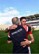 8 August 2021; Tim O'Mahony of Cork is congratulated by manager Kieran Kingston during the GAA Hurling All-Ireland Senior Championship semi-final match between Kilkenny and Cork at Croke Park in Dublin. Photo by David Fitzgerald/Sportsfile