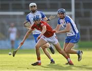 9 August 2021; Diarmuid Healy of Cork in action against Aaron O'Neill, right, and Marc Ó Mathúna of Waterford during the Electric Ireland Munster Minor Hurling Championship Final match between Cork and Waterford at Semple Stadium in Thurles, Tipperary. Photo by Piaras Ó Mídheach/Sportsfile