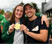 10 August 2021; Gold medallist Kellie Harrington with WBA Interim World Featherweight title holder Michael Conlan at Dublin Airport as Team Ireland's boxers return from the Tokyo 2020 Olympic Games. Photo by Seb Daly/Sportsfile