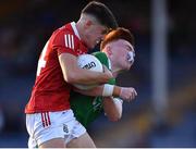 11 August 2021; Bryan Hayes of Cork is tackled by Aaron Neville of Limerick during the Electric Ireland Munster minor football championship final match between Cork and Limerick at Semple Stadium in Thurles, Tipperary.  Photo by Piaras Ó Mídheach/Sportsfile