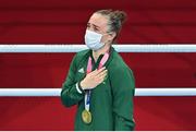 8 August 2021; Kellie Harrington of Ireland stands for the playing of the Irish national anthem after receiving her gold medal after defeating Beatriz Ferreira of Brazil in their women's lightweight final bout with at the Kokugikan Arena during the 2020 Tokyo Summer Olympic Games in Tokyo, Japan.Amhrán na bhFiann Photo by Brendan Moran/Sportsfile