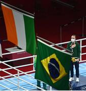 8 August 2021; Kellie Harrington of Ireland stands for the playing of the Irish national anthem after receiving her gold medal after defeating Beatriz Ferreira of Brazil in their women's lightweight final bout with at the Kokugikan Arena during the 2020 Tokyo Summer Olympic Games in Tokyo, Japan.Amhrán na bhFiann Photo by Brendan Moran/Sportsfile