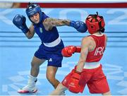 8 August 2021; Beatriz Ferreira of Brazil, left, and Kellie Harrington of Ireland during their women's lightweight final bout at the Kokugikan Arena during the 2020 Tokyo Summer Olympic Games in Tokyo, Japan. Photo by Brendan Moran/Sportsfile