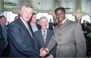 6 February 1995; WBO super middleweight champion Chris Eubank with promoter Barry Hearn, left, and owner of the Green Glens Arena in Millstreet, Noel C Duggan, as he arrives for a press conference at the Jury's Hotel in Ballsbridge, Dublin ahead of his WBO super middleweight title fight against Steve Collins in Cork in March. Photo by David Maher/Sportsfile