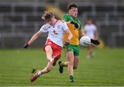 13 August 2021; Ronan Donnelly of Tyrone in action against Luke McGlynn of Donegal during the Electric Ireland Ulster GAA Football Minor Championship Final match between Donegal and Tyrone at Brewster Park in Enniskillen, Fermanagh. Photo by Ben McShane/Sportsfile