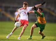13 August 2021; Gavin Potter of Tyrone in action against Ethan Freil of Donegal during the Electric Ireland Ulster GAA Football Minor Championship Final match between Donegal and Tyrone at Brewster Park in Enniskillen, Fermanagh. Photo by Ben McShane/Sportsfile