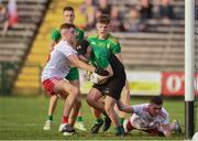 13 August 2021; Donegal goalkeeper Aaron Cullen evades the tackle of Tyrone players Ronan Cassidy, left, and Paddy McCann during the Electric Ireland Ulster GAA Football Minor Championship Final match between Donegal and Tyrone at Brewster Park in Enniskillen, Fermanagh. Photo by Ben McShane/Sportsfile