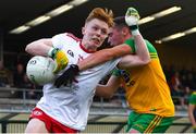 13 August 2021; Karl Magee of Donegal intercepts the ball from Cormac Devlin of Tyrone during the Electric Ireland Ulster GAA Football Minor Championship Final match between Donegal and Tyrone at Brewster Park in Enniskillen, Fermanagh. Photo by Ben McShane/Sportsfile