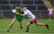 13 August 2021; Daniel Marley of Donegal in action against Matthew Mallon of Tyrone during the Electric Ireland Ulster GAA Football Minor Championship Final match between Donegal and Tyrone at Brewster Park in Enniskillen, Fermanagh. Photo by Ben McShane/Sportsfile