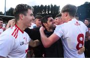 13 August 2021; Tyrone manager Gerard Donnelly, centre, celebrates with his players after the Electric Ireland Ulster GAA Football Minor Championship Final match between Donegal and Tyrone at Brewster Park in Enniskillen, Fermanagh. Photo by Ben McShane/Sportsfile