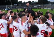 13 August 2021; Tyrone manager Gerard Donnelly, top, celebrates with his players after the Electric Ireland Ulster GAA Football Minor Championship Final match between Donegal and Tyrone at Brewster Park in Enniskillen, Fermanagh. Photo by Ben McShane/Sportsfile