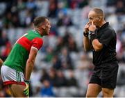 14 August 2021; Referee Conor Lane and Eoghan McLaughlin of Mayo during the GAA Football All-Ireland Senior Championship semi-final match between Dublin and Mayo at Croke Park in Dublin. Photo by Seb Daly/Sportsfile