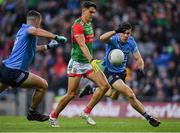 14 August 2021; Tommy Conroy of Mayo in action against David Byrne, right, and Brian Howard of Dublin during the GAA Football All-Ireland Senior Championship semi-final match between Dublin and Mayo at Croke Park in Dublin. Photo by Seb Daly/Sportsfile
