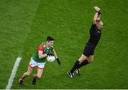 14 August 2021; Referee Conor Lane avoids Conor Loftus of Mayo during the GAA Football All-Ireland Senior Championship semi-final match between Dublin and Mayo at Croke Park in Dublin. Photo by Stephen McCarthy/Sportsfile